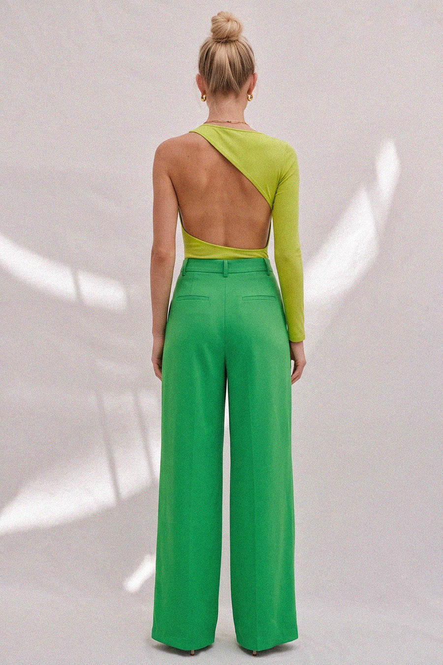 Full look back - Chartreuse One-Sleeve Open Back Top with green trousers
